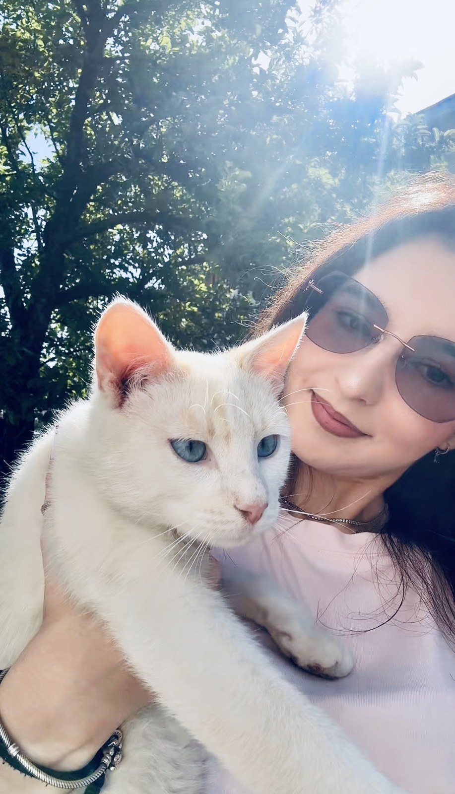 Teofana with her white cat